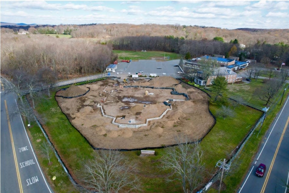 Most Blessed Sacrament Church rebuild site has been graded, and outline of new church installed.