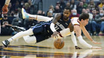 Orlando Magic's Terrence Ross (31) and Cleveland Cavaliers' Cedi Osman (16) battle for a loose ball in the first half of an NBA basketball game, Saturday, Nov. 27, 2021, in Cleveland. (AP Photo/Tony Dejak)