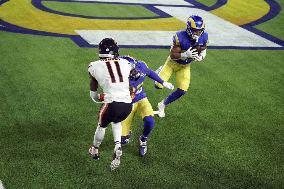 Los Angeles Rams safety Taylor Rapp, right, intercepts a tipped pass intended for Chicago Bears wide receiver Darnell Mooney (11) during the second half of an NFL football game Monday, Oct. 26, 2020, in Inglewood, Calif. (AP Photo/Ashley Landis )