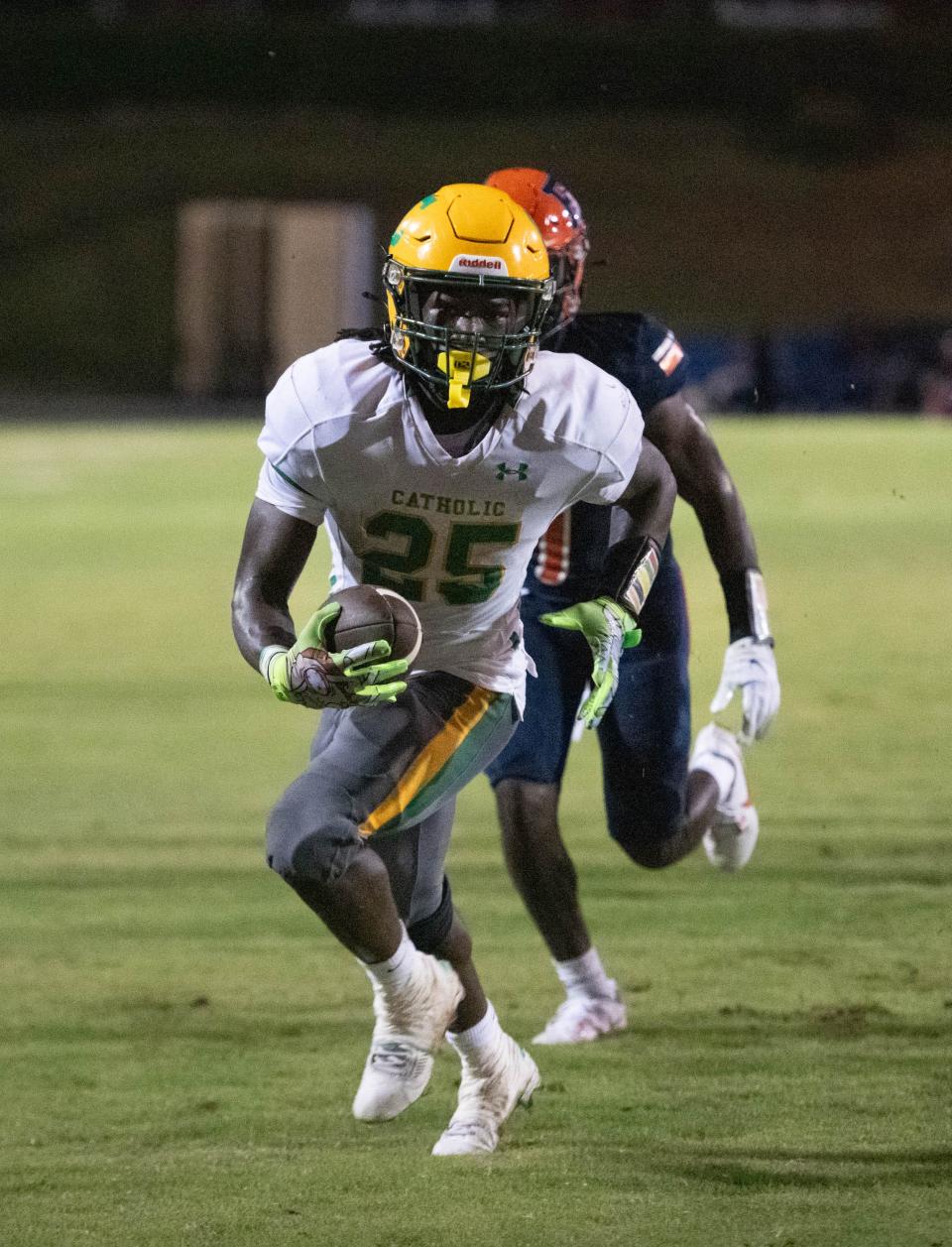 CJ Nettles (25) takes it in for a touchdown and a 12-0 Crusaders lead during the Pensacola Catholic vs Escambia football game at Escambia High School in Pensacola on Friday, Sept. 1, 2023.