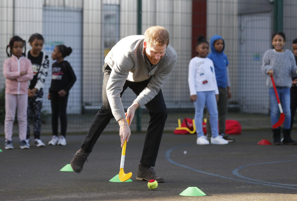 LONDON, ENGLAND - FEBRUARY 15: Prince Harry shows off his hockey skills as he visits a Fit and Fed February school holiday activity programme at the Roundwood Youth Centre on February 15, 2017 in London, England. The Fit and Fed Campaign aims to provide children and young people with free access to activity sessions and a nutritious lunch during school holidays, with community sport and wellbeing charity 'Sport at the Heart' which is part of the Fit and Fed campaign. (Photo by Frank Augstein - WPA Pool/Getty Images)