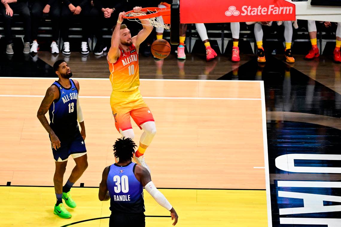 Team Giannis center Domantas Sabonis (10) dunks the ball as Team LeBron forward Paul George (13) looks on during the first half in the 2023 NBA All-Star Game Feb. 19, 2023, at Vivint Arena in Salt Lake City, Utah.