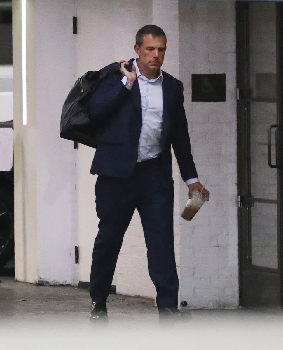 Ben Affleck steps out in a sharp suit for another day at the office. Ben is seen still wearing his wedding ring.