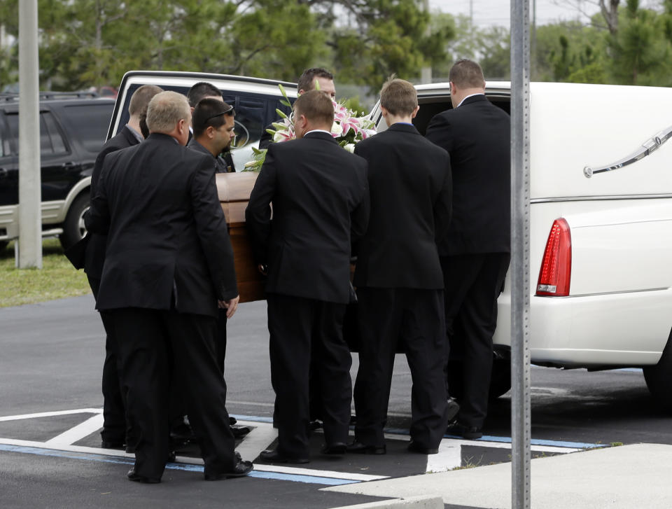 Pall bearers place the casket of country music star Mindy McCready into a hearse after a funeral ceremony at the Crossroads Baptist Church in Fort Myers, Fla., Tuesday, Feb. 26, 2013. McCready committed suicide on Feb. 17 at her home in Arkansas, days after leaving a court-ordered substance abuse program. (AP Photo/Alan Diaz)