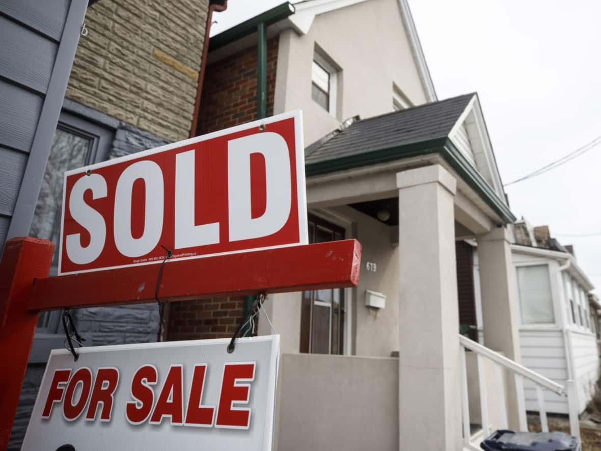 Last week, Toronto police asked the public for help after a pair of homeowners returned to Canada to find their home sold without their knowledge in 2022. CBC News has learned that wasn't an isolated case.  (Cole Burston/Bloomberg - image credit)