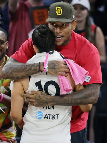 <p>Ethan Miller/Getty</p> Kelsey Plum and Darren Waller after the Aces 89-78 victory over the Chicago Sky in 2022.