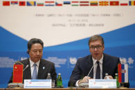 Serbian President Aleksandar Vucic, right, and Chinese Transport Minister Li Xiaopeng attend a meeting of China and 16 countries of central and eastern Europe in Belgrade, Serbia, Tuesday, Oct. 16, 2018. The gathering focusing on transport is part of China's "New Silk Road" initiative to increase global influence through economic links and investment. (AP Photo/Darko Vojinovic).