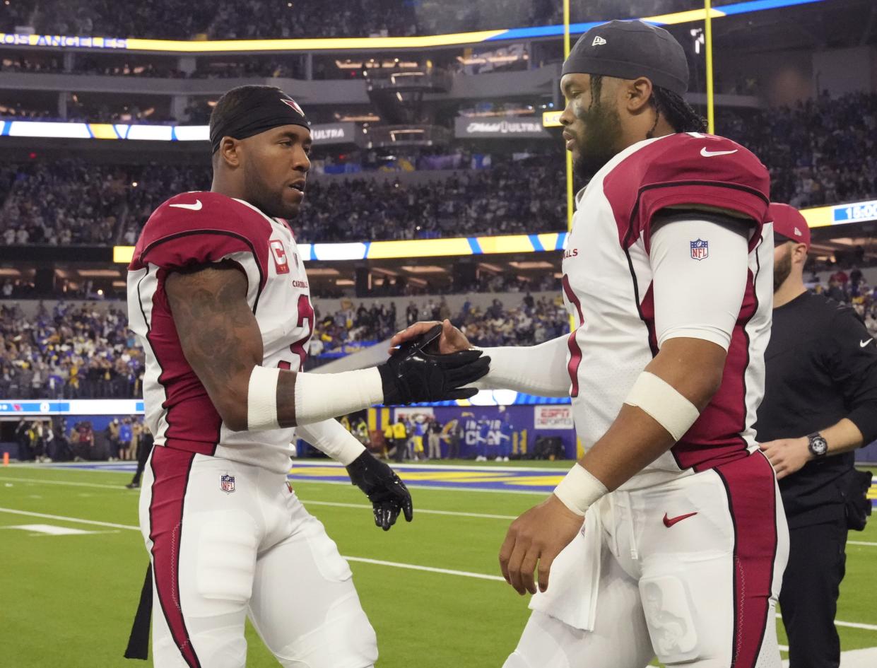 Arizona Cardinals safety Budda Baker (3) shakes hands with quarterback Kyler Murray (1) before playing against the Los Angeles Rams in the NFC Wild Card playoff game in Inglewood, Calif., on Jan. 17, 2022.