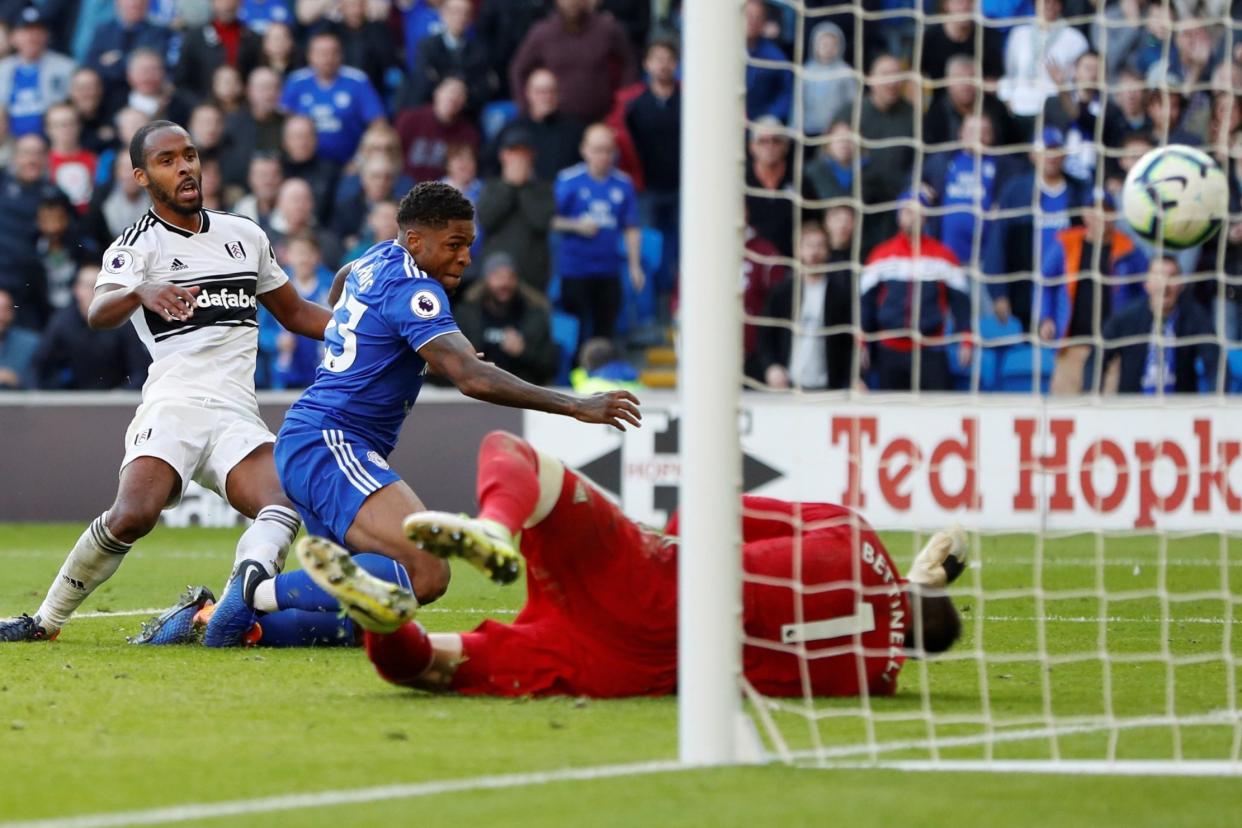 Leaking goals: Fulham keeper Marcus Bettinelli is left diving in despair as Khadeem Harris scores Cardiff’s fourth on Saturday in another heavy defeat: Action Images via Reuters