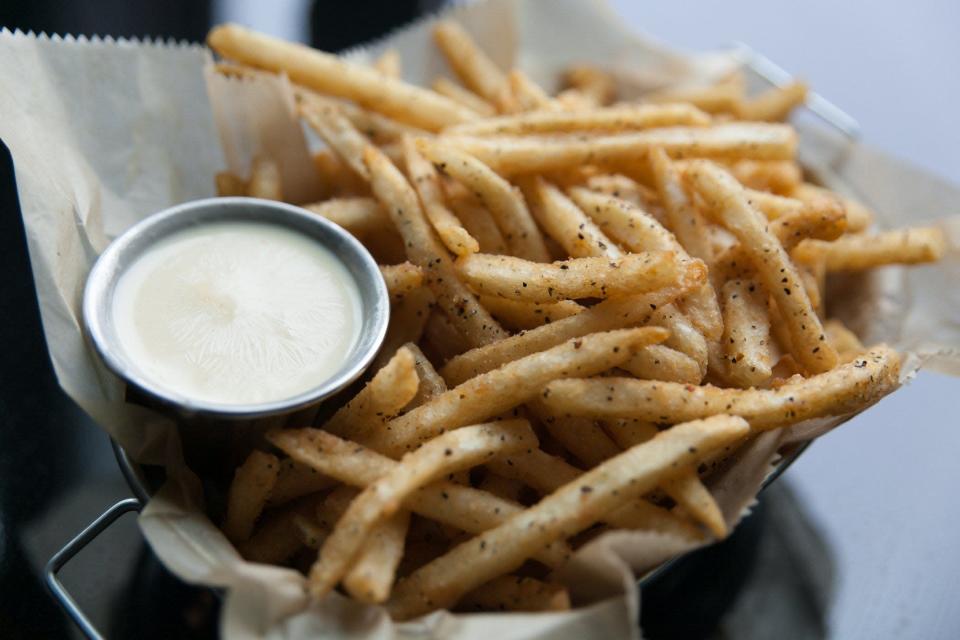 An order of HopCat's popular beer-battered, seasoned Crack Fries, pictured with warm dipping cheese, at HopCat Restaurant and Craft Beer Bar in Detroit on Saturday, December 13, 2014.