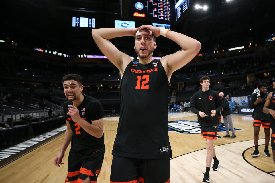 INDIANAPOLIS, INDIANA - MARCH 27: Roman Silva #12 of the Oregon State Beavers celebrates after defeating the Loyola-Chicago Ramblers in the Sweet Sixteen round of the 2021 NCAA Men's Basketball Tournament at Bankers Life Fieldhouse on March 27, 2021 in Indianapolis, Indiana. (Photo by Jamie Squire/Getty Images)