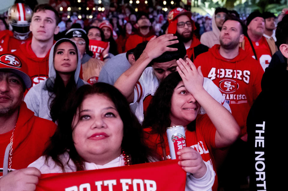 San Francisco 49ers fans react while watching a telecast of NFL football's Super Bowl 58 on a screen outside the Chase Center in San Francisco on Sunday, Feb. 11, 2024. (AP Photo/Noah Berger)