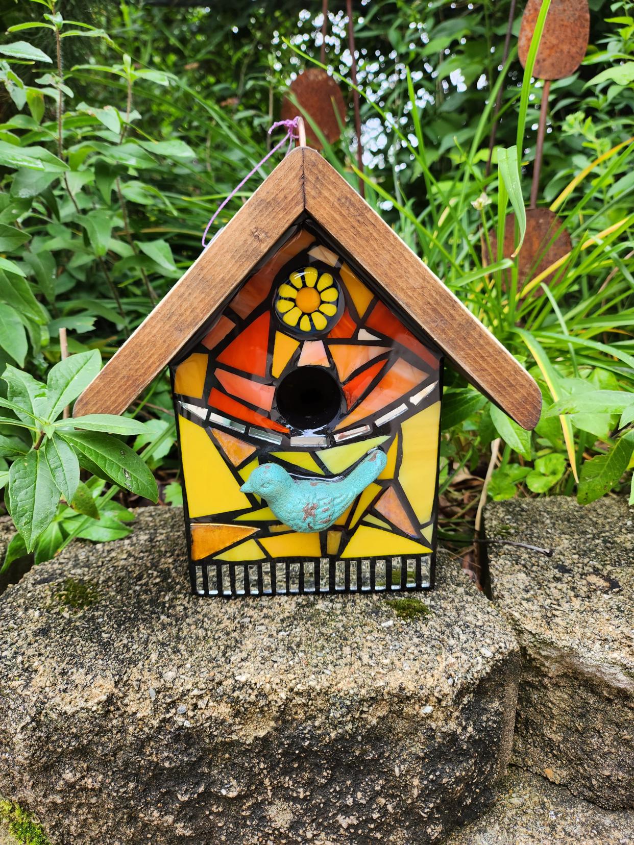 Green Bay artist Kimberly Moon Young creates art in several mediums, including these mosaic birdhouses.