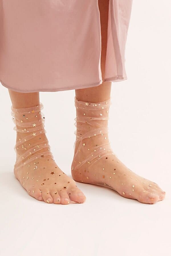 Your fancy friend definitely won't settle for plain socks. These <a href="https://fave.co/36pHGXw" target="_blank" rel="noopener noreferrer">sheer socks with stars</a> can be dressed up or down, depending on her mood.