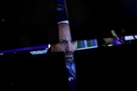 A specialist trader works inside a post on the floor of the NYSE in New York