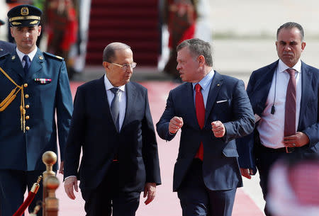 Lebanon's President Michel Aoun is welcomed by Jordan's King Abdullah II during a reception ceremony at the Queen Alia International Airport in Amman, Jordan March 28, 2017. REUTERS/Muhammad Hamed