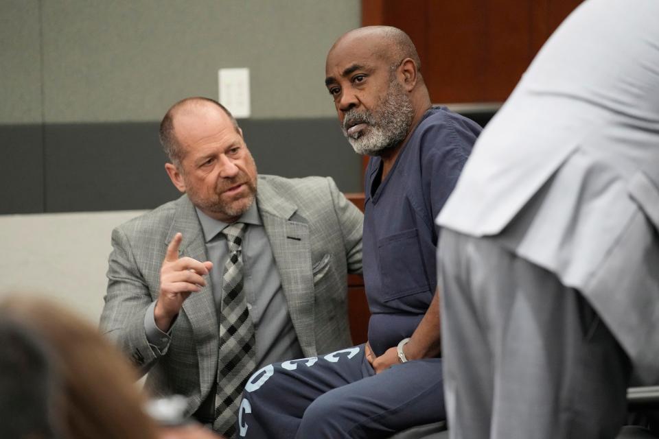 Duane "Keffe D" Davis, right, speaks with attorney Ross Goodman in court on Oct. 19. A Las Vegas judge has allowed him to serve house arrest ahead of his June criminal trial.
