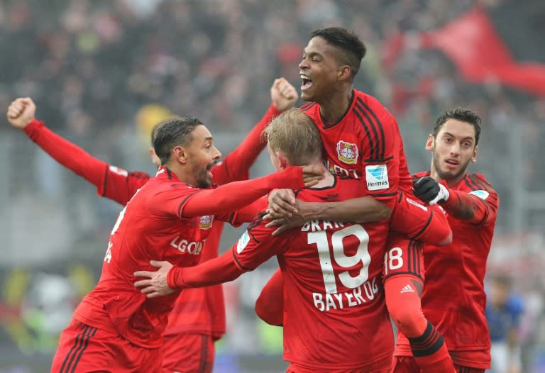 Leverkusen's players celebrate after Julian Brandt scored the 2-1 during the Bundesliga football match against Darmstadt on February 13, 2016