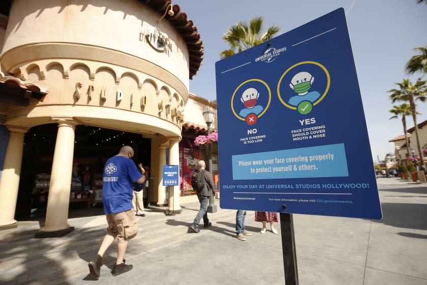 LOS ANGELES, CA - APRIL 15: Signage encourages guests for proper protection as Universal Studios Hollywood is welcoming guests back to the Theme Park Friday, April 16 to experience the thrill rides and attractions. Universal Studios Hollywood is working with health and government officials to implement new health and safety procedures that include controlled capacity to enforce physical distancing and required face coverings as safeguards for the Coronavirus pandemic. In accordance with government guidelines, only California residents may visit at this time. Universal City Hollywood on Thursday, April 15, 2021 in Los Angeles, CA. (Al Seib / Los Angeles Times).