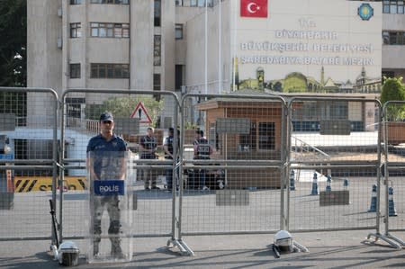 Turkish police stand guard in front of the Metropolitan Municipality headquarters in Diyarbakir