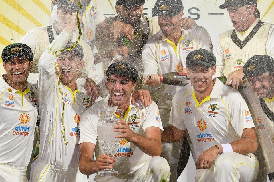 Pictured centre, Australia's captain Pat Cummins celebrates with the Ashes trophy after his side's 4-0 series victory over England.