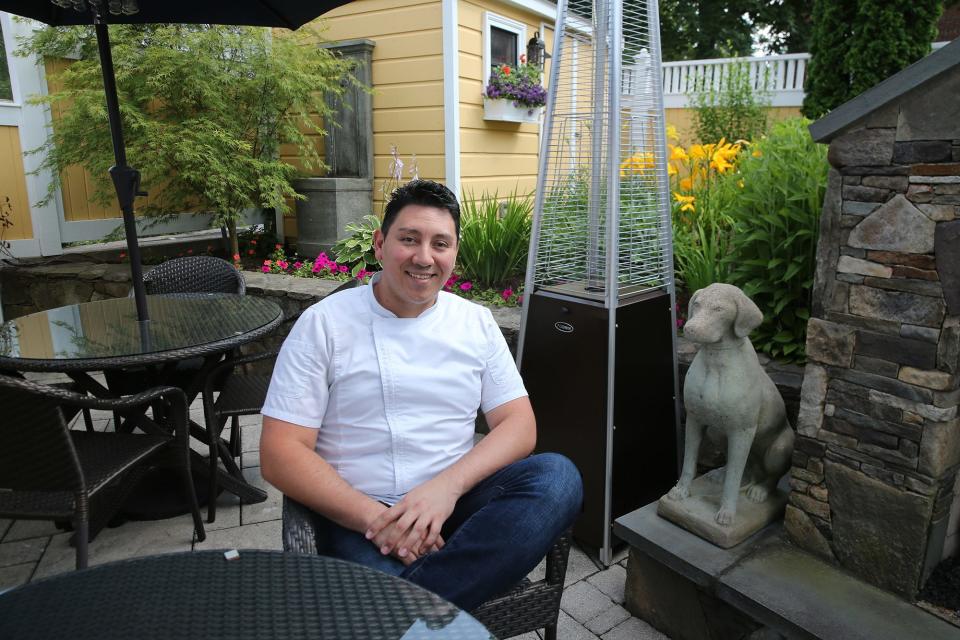 Chef Stanley Orantes of Ambrose Restaurant in Exeter shows off the patio, where dining and cocktail service is offered.