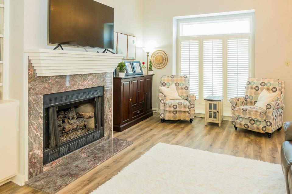 The living room is a comfortable place to relax at the end of the day. The fireplace was an added bonus.