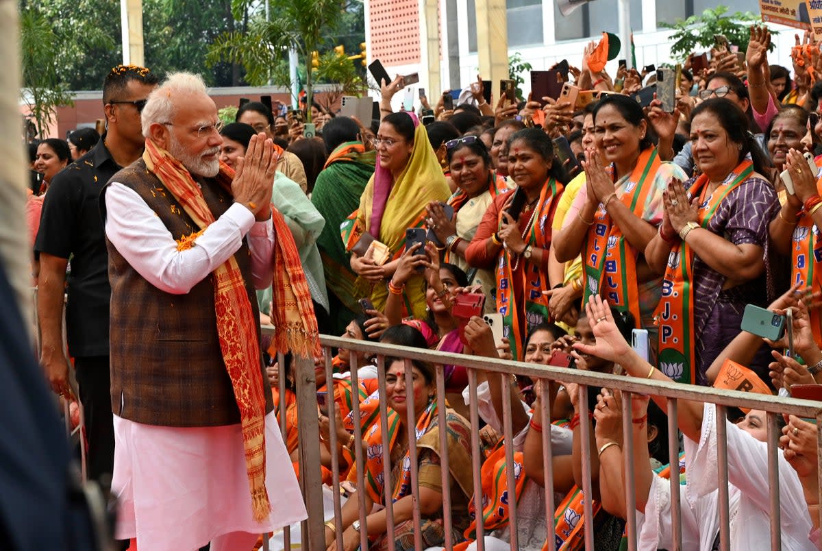Prime minister Narendra Modi being felicitated by women at the Bharatiya Janata Party (BJP) headquarters in New Delhi, India  (AP)