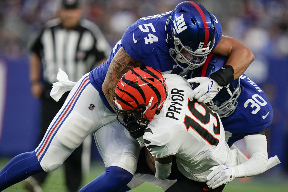 New York Giants' Blake Martinez tackles Cincinnati Bengals' Kendric Pryor (19) during the first half of a preseason NFL football game, Sunday, Aug. 21, 2022, in East Rutherford, N.J. (AP Photo/Julia Nikhinson)