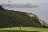 Mackenzie Hughes, of Canada, putts on the third green during the final round of the U.S. Open Golf Championship, Sunday, June 20, 2021, at Torrey Pines Golf Course in San Diego. (AP Photo/Gregory Bull)