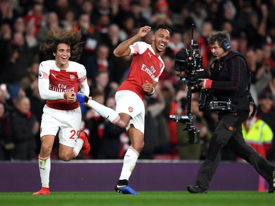 Pierre-Emerick Aubameyang celebrates his second goal for Arsenal: Getty Images