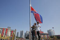 Soldiers raise the North Korea national flag before a parade for the 70th anniversary of North Korea's founding day in Pyongyang, North Korea, Sunday, Sept. 9, 2018. North Korea staged a major military parade, huge rallies and will revive its iconic mass games on Sunday to mark its 70th anniversary as a nation. (AP Photo/Kin Cheung)