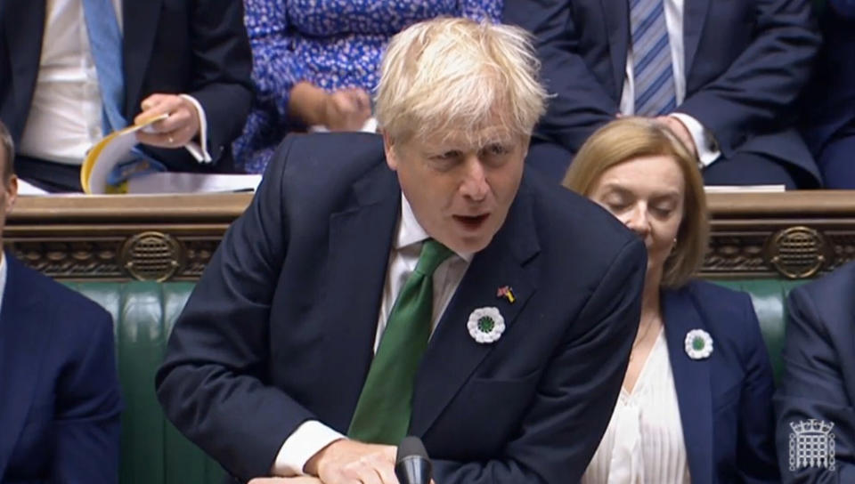 In this grab taken from video from the House of Commons, Britain's Prime Minister Boris Johnson speaks during Prime Minister's Questions in the House of Commons, London, Wednesday July 13, 2022. Conservative Party lawmakers in Britain are casting ballots Wednesday in the first round of an election to replace Prime Minister Boris Johnson. (House of Commons/PA via AP)