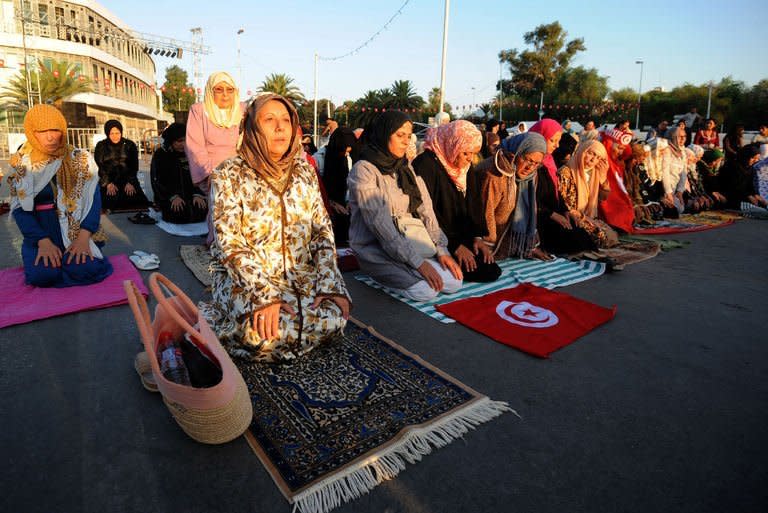 Tunisians hold a sit-in against the government, August 8, 2013 outside the Constituent Assembly headquarters in Tunis. The head of Tunisia's ruling Islamist party Ennahda is to meet the powerful UGTT trade union chief on Monday on the crisis sparked by the killing of an opposition politician