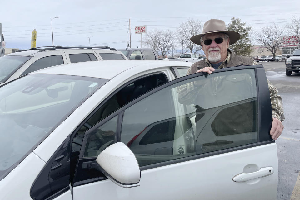 Raleigh Snyder gets into a vehicle in this photograph taken Friday, Dec. 30, 2022, in Grand Junction, Colo. (AP Photo/Jesse Bedayn)