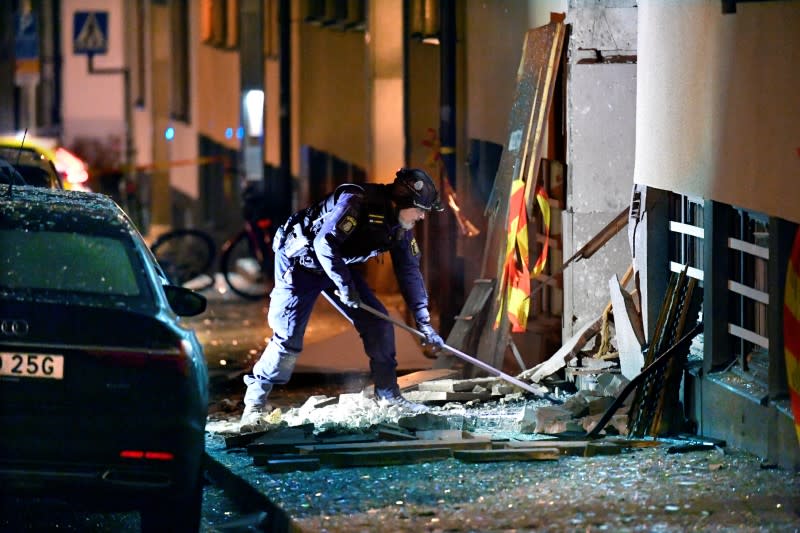 FILE PHOTO: Police work on the site where an explosion damaged a residential building in central Stockholm