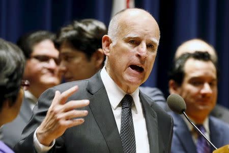 California Governor Jerry Brown speaks before signing a bill hiking California's minimum wage to $15 by 2023 in Los Angeles, California, United States, April 4, 2016. REUTERS/Lucy Nicholson