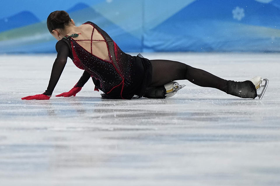 Kamila Valieva, of the Russian Olympic Committee, falls in the women's free skate program during the figure skating competition at the 2022 Winter Olympics, Thursday, Feb. 17, 2022, in Beijing. (AP Photo/David J. Phillip)
