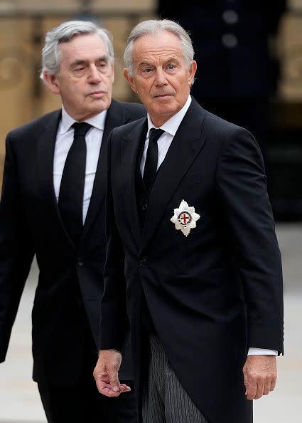 LONDON, ENGLAND - SEPTEMBER 19: Former Prime Ministers Gordon Brown and Tony Blair arrive at Westminster Abbey ahead of The State Funeral of Queen Elizabeth II on September 19, 2022 in London, England. Elizabeth Alexandra Mary Windsor was born in Bruton Street, Mayfair, London on 21 April 1926. She married Prince Philip in 1947 and ascended the throne of the United Kingdom and Commonwealth on 6 February 1952 after the death of her Father, King George VI. Queen Elizabeth II died at Balmoral Castle in Scotland on September 8, 2022, and is succeeded by her eldest son, King Charles III.  (Photo by Christopher Furlong/Getty Images)