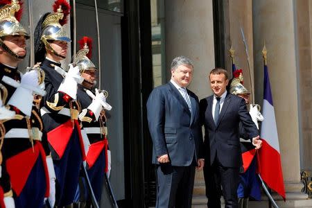 French President Emmanuel Macron meets with Ukrainian President Petro Poroshenko at the Elysee Palace in Paris, France, June 26, 2017. REUTERS/Philippe Wojazer