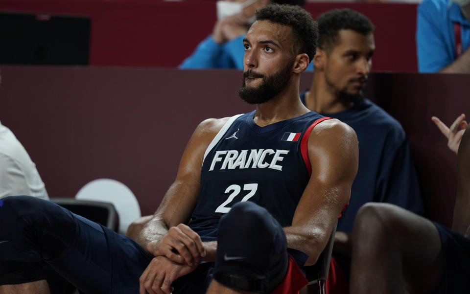 France's Rudy Gobert (27) reacts after their loss in the men's basketball gold medal game against the United States at the 2020 Summer Olympics, Saturday, Aug. 7, 2021, in Saitama, Japan. (AP Photo/Charlie Neibergall)