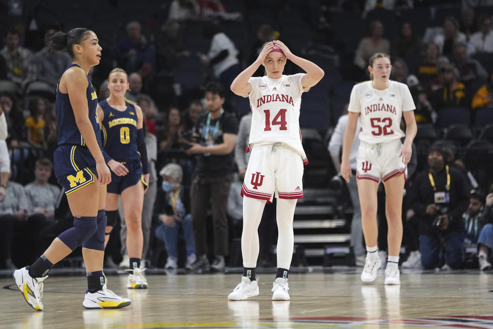 Indiana guard Sara Scalia (14) reacts on the court during the final seconds of the team's loss to Michigan during an NCAA college basketball quarterfinal game at the Big Ten women's tournament Friday, March 8, 2024, in Minneapolis. (AP Photo/Abbie Parr)