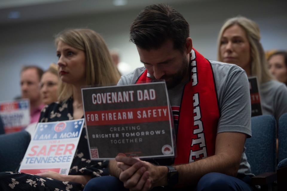 Covenant School parents Madelynne Moulton and Nick Hansen listen during a House committee meeting at the Cordell Hull State Office Building on Aug. 24 in Tenn. A shooter killed three people, including three children, at the school March 27.