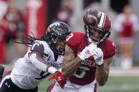 Indiana's Ty Fryfogle (3) tries to make a cat while being defended by Cincinnati's Arquon Bush (9) during the second half of an NCAA college football game, Saturday, Sept. 18, 2021, in Bloomington, Ind. Cincinnati won 38-24. (AP Photo/Darron Cummings)