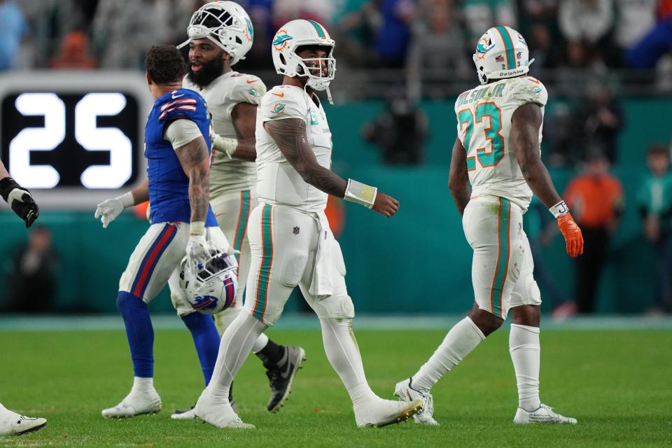 Jan 7, 2024; Miami Gardens, Florida, USA; Miami Dolphins quarterback Tua Tagovailoa (1) walks off the field after throwing an interception late in the game at Hard Rock Stadium. Mandatory Credit: Jim Rassol-USA TODAY Sports