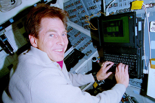  STS-67 payload specialist Samuel Durrance works with the Astro-2 data display system set up on space shuttle Endeavour&#39;s flight deck in March 1995. 