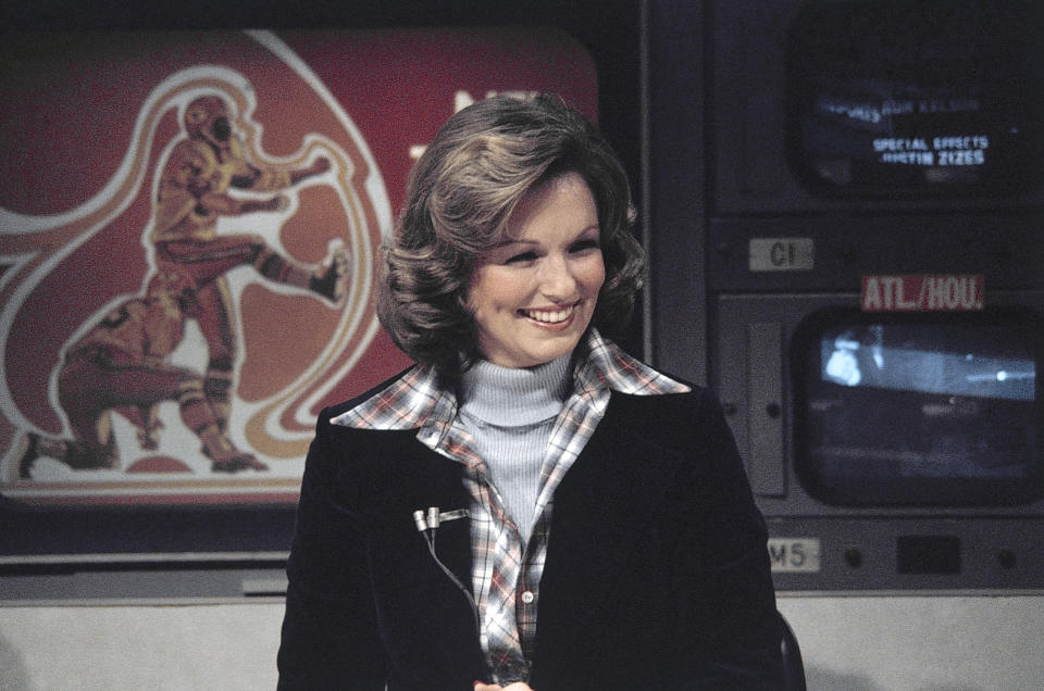 FILE - In this Nov. 28, 1976 file photo, CBS sportscaster Phyllis George is seen in New York. Phyllis George, the former Miss America who became a female sportscasting pioneer on CBS's “The NFL Today” and served as the first lady of Kentucky, has died. She was 70. A family spokeswoman said George died Thursday, May 14, 2020, at a Lexington hospital after a long fight with a blood disorder.(AP Photo/Suzanne Vlamis, File)