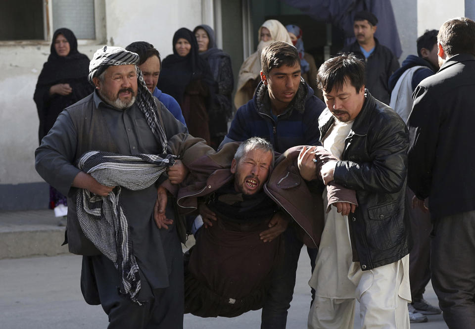 <p>A distraught man is carried following a suicide attack in Kabul, Afghanistan, Thursday, Dec. 28, 2017. (Photo: Rahmat Gul/AP) </p>