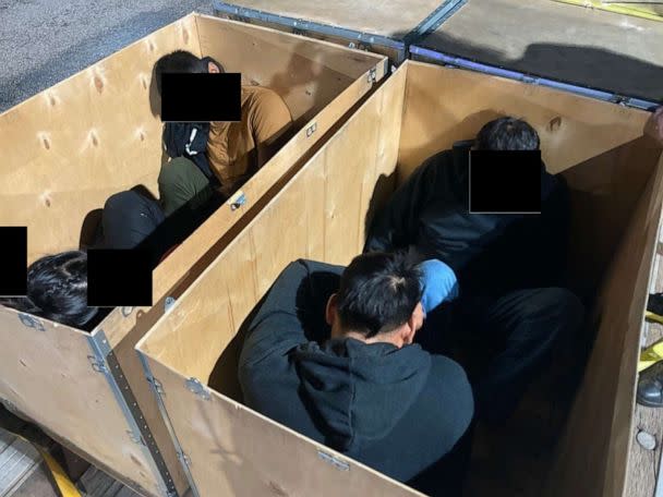 PHOTO:  Migrants inside a wooden crate are seen in an handout from DOJ. (United States Department of Justice)