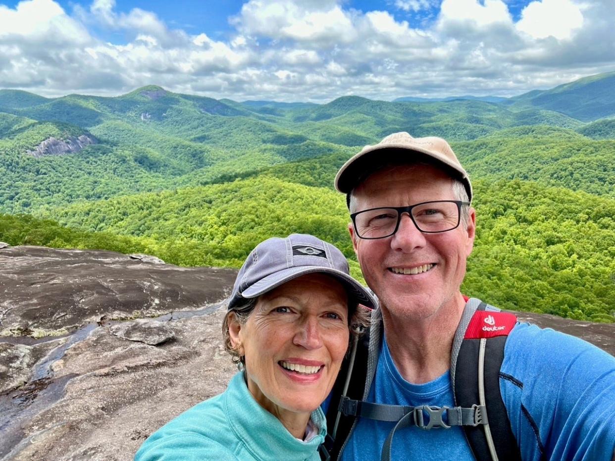 Husband and wife Leslie Ann Keller and Graham Ramsey of Asheville take a selfie on top of Looking Glass Rock in the Pisgah National Forest.